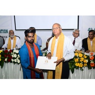 student receiving degree certificate