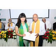 Student receiving degree certificate
