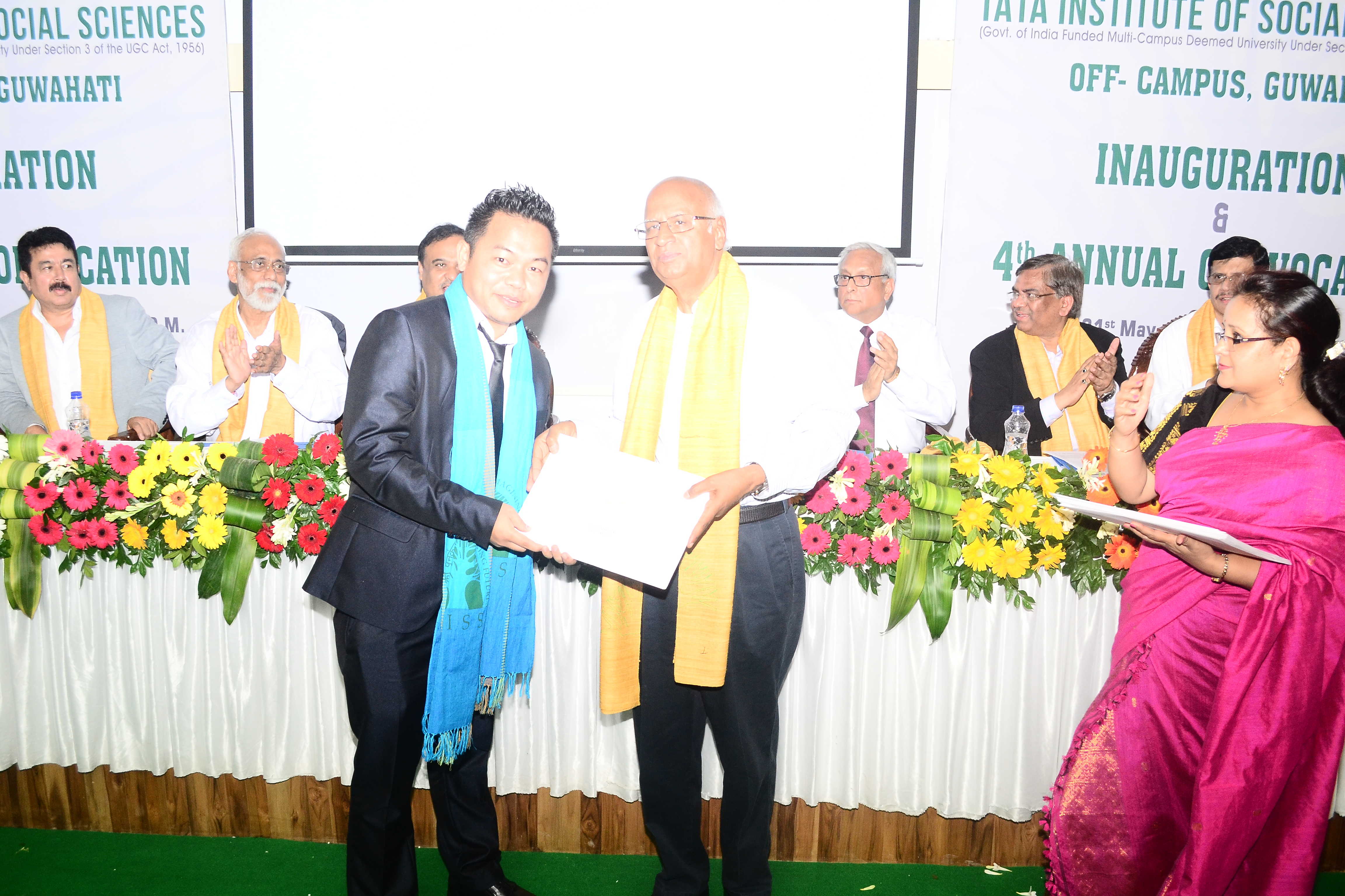 Student receiving degree certificate