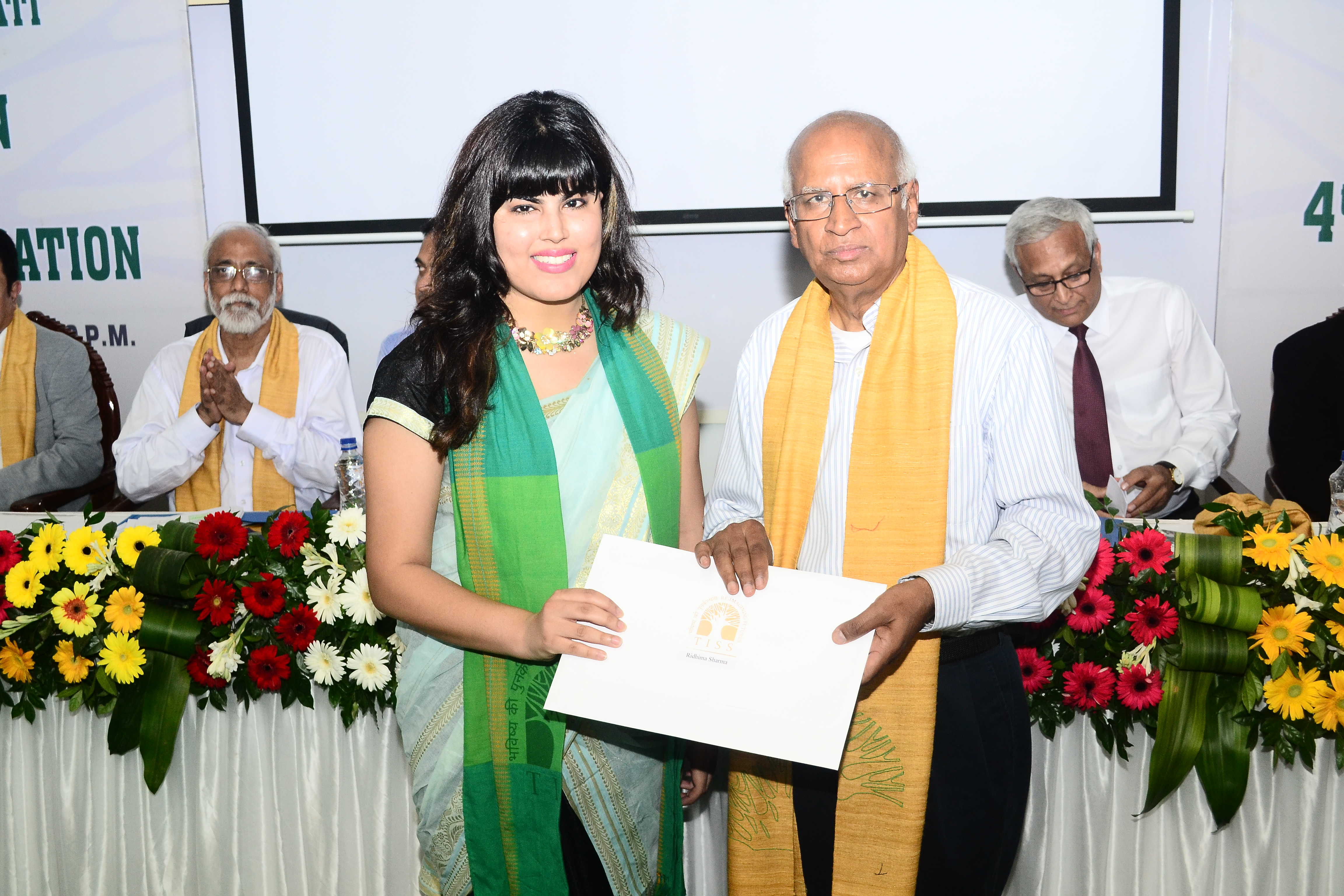 Student receiving degree certificate