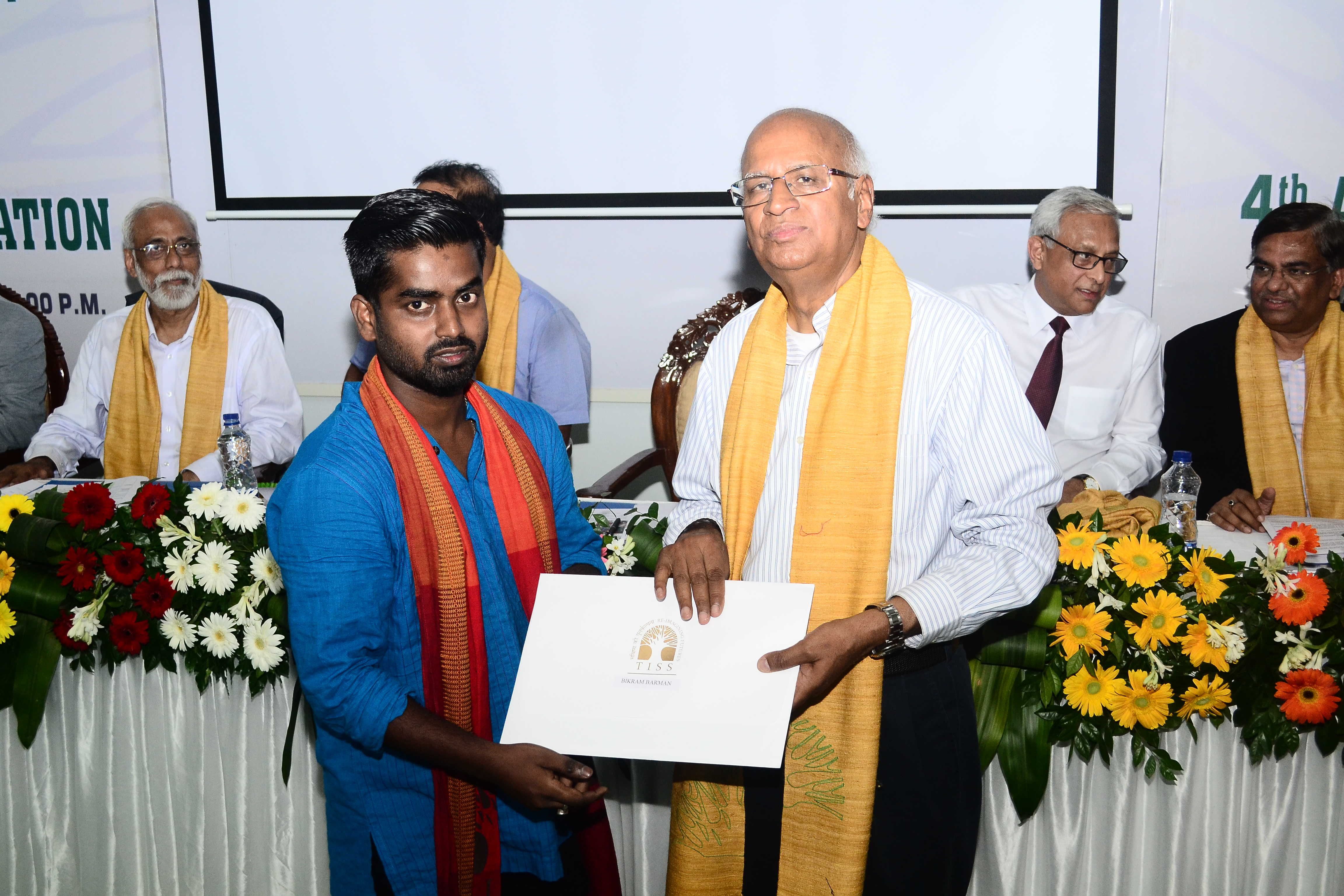student receiving degree certificate