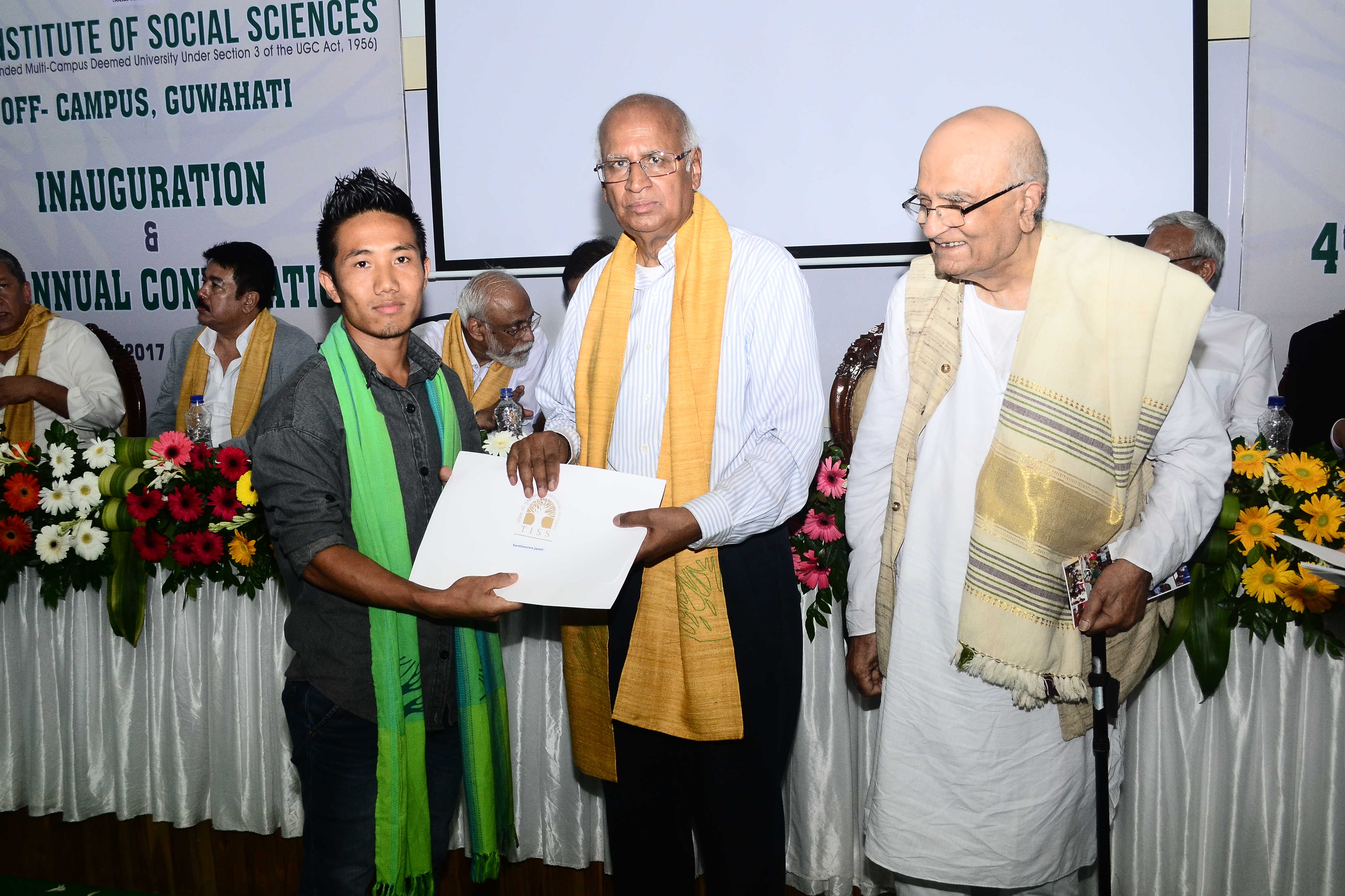 Student receiving degree certificate