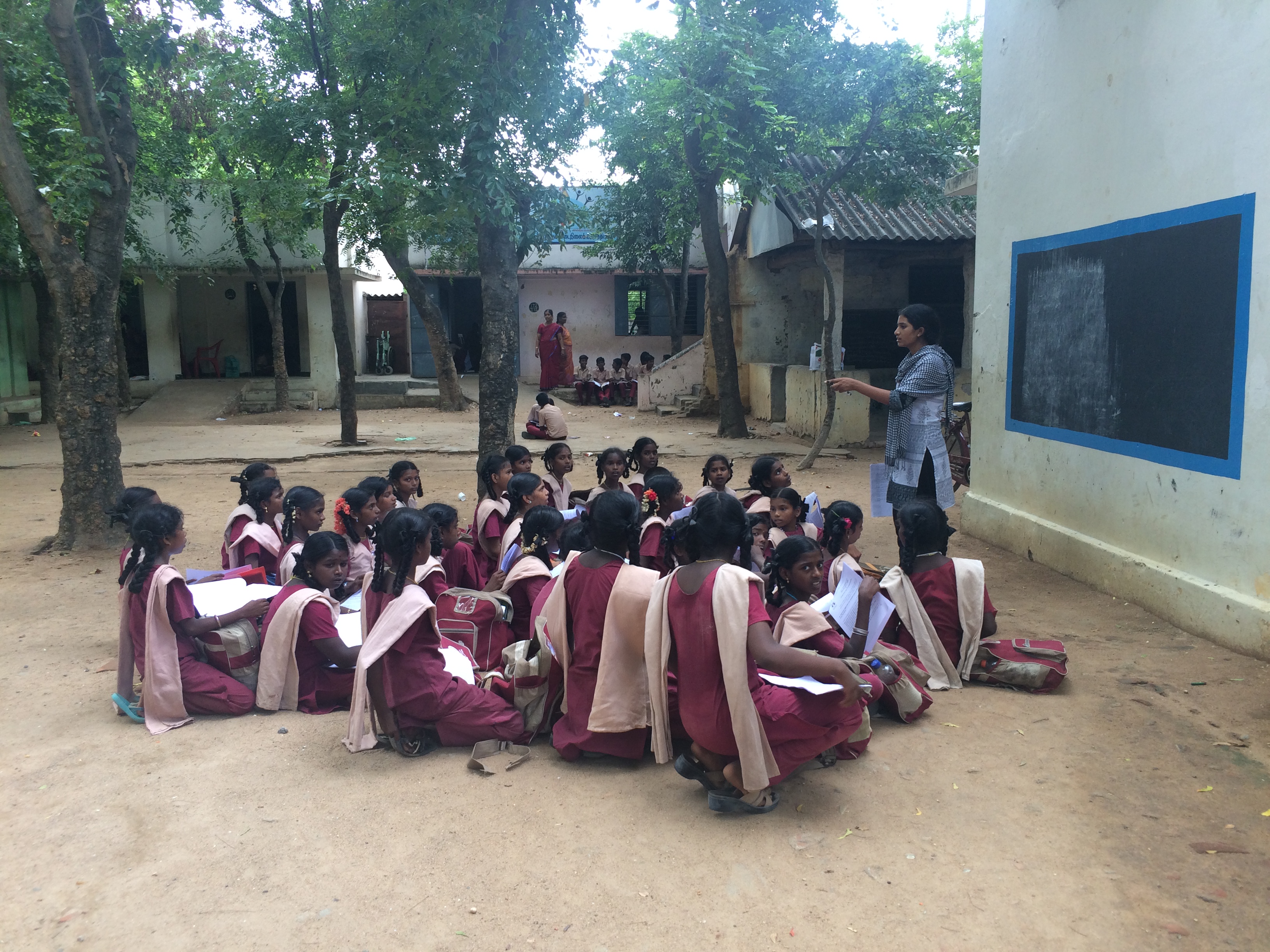 In Tamil Nadu: Girls learning about the survey for Menstrual Hygiene Management (MHM) from a field staff